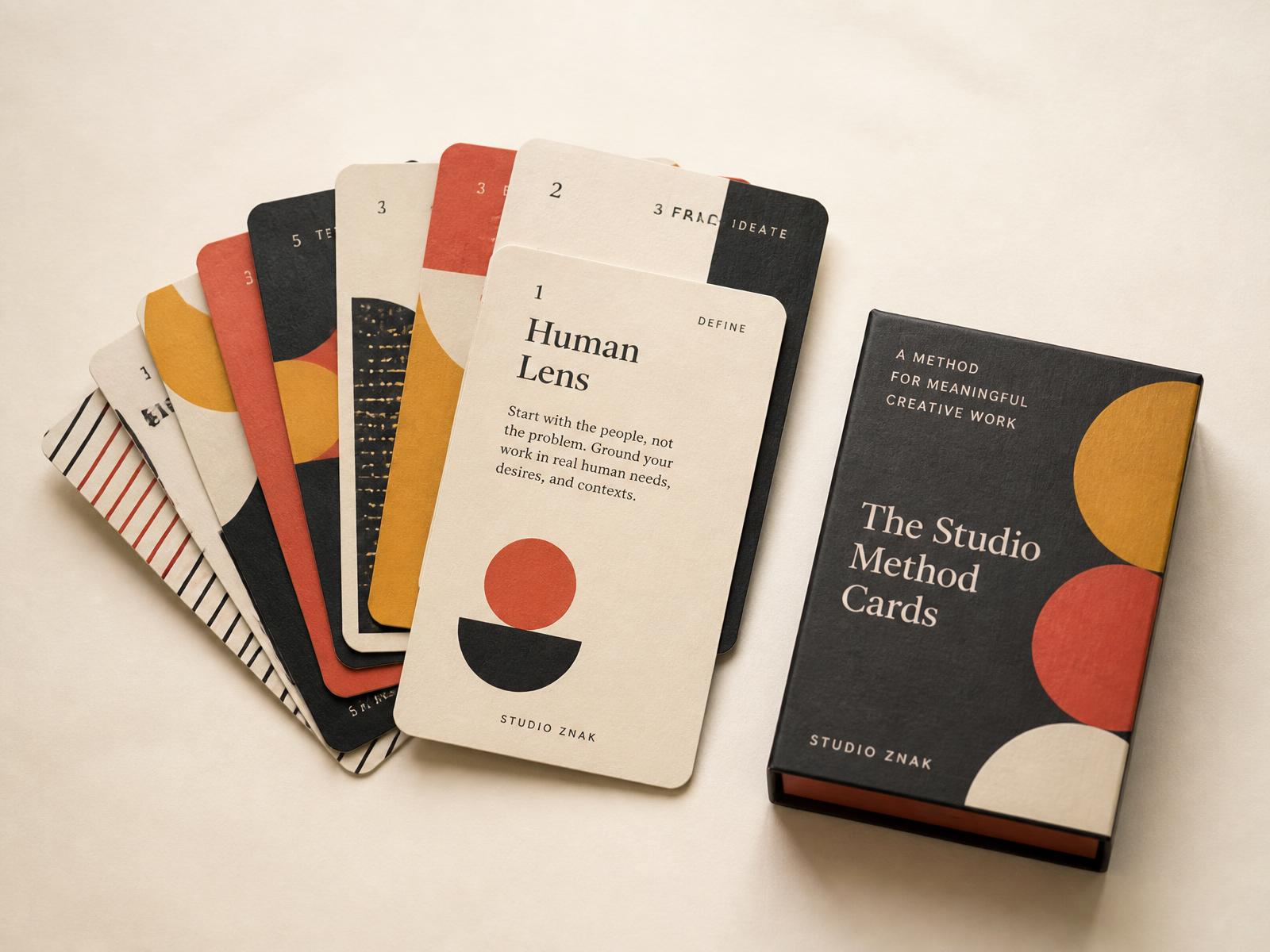 Premium card deck fanned out next to its rigid box